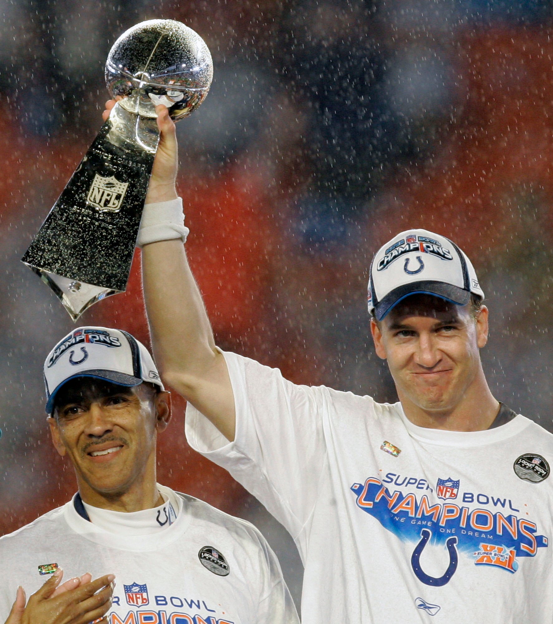 Peyton Manning brings in the Lombardi Trophy