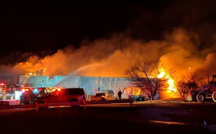 Crews from 2 counties battle massive fire at business near Seymour