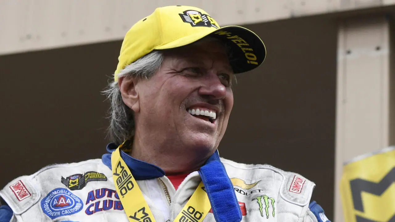 NHRA Funny Car driver John Force celebrates a victory on stage at the Dodge Mile-High NHRA Nationals at Bandimere Speedway in Morrison, Colorado, on July 22, 2018. Force remained hospitalized in intensive care Monday, one day after a fiery, 300-mph crash in the Virginia Nationals at Virginia Motorsports Park.(Photo by Andy Cross/The Denver Post via Getty Images)