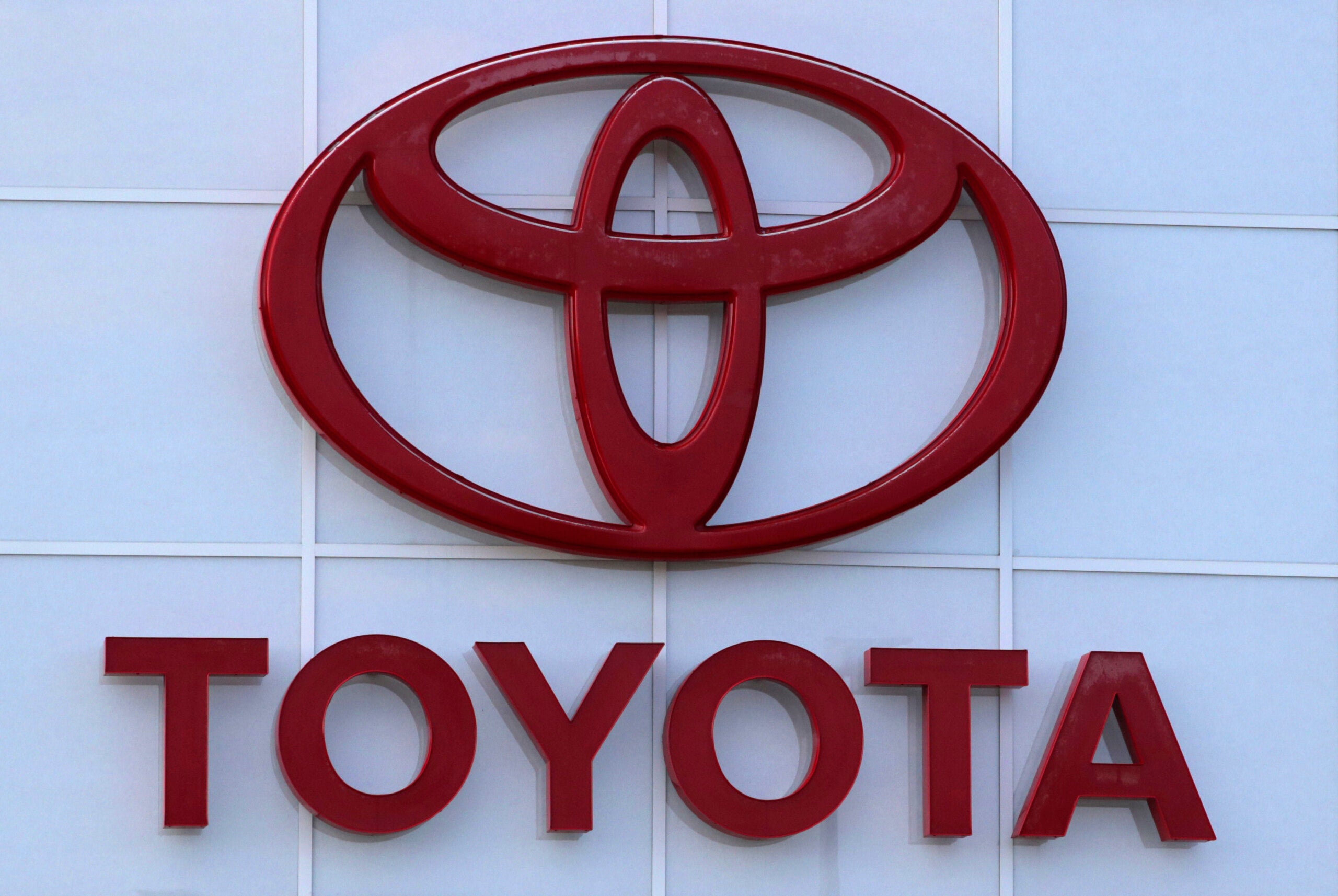 FILE - The Toyota logo is shown on a dealership in Manchester, N.H., in this Thursday, Aug. 15, 2019, file photo. Toyota plans to build a new $1.29 billion factory in the U.S. to manufacture batteries for gas-electric hybrid and fully electric vehicles. The plant location wasn't announced, but the company said it eventually will employ 1,750 people and start making batteries in 2025, gradually expanding through 2031. (AP Photo/Charles Krupa, File)