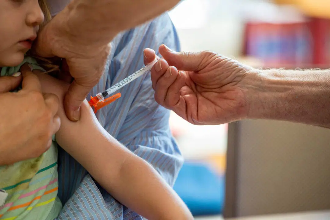 A young child receives a vaccination in Massachusetts on June 21, 2022. Doctors are sounding the alarm after more than 40% of Indiana’s toddlers did not get their recommended vaccines last year.(Photo by Joseph Prezioso/AFP via Getty Images)