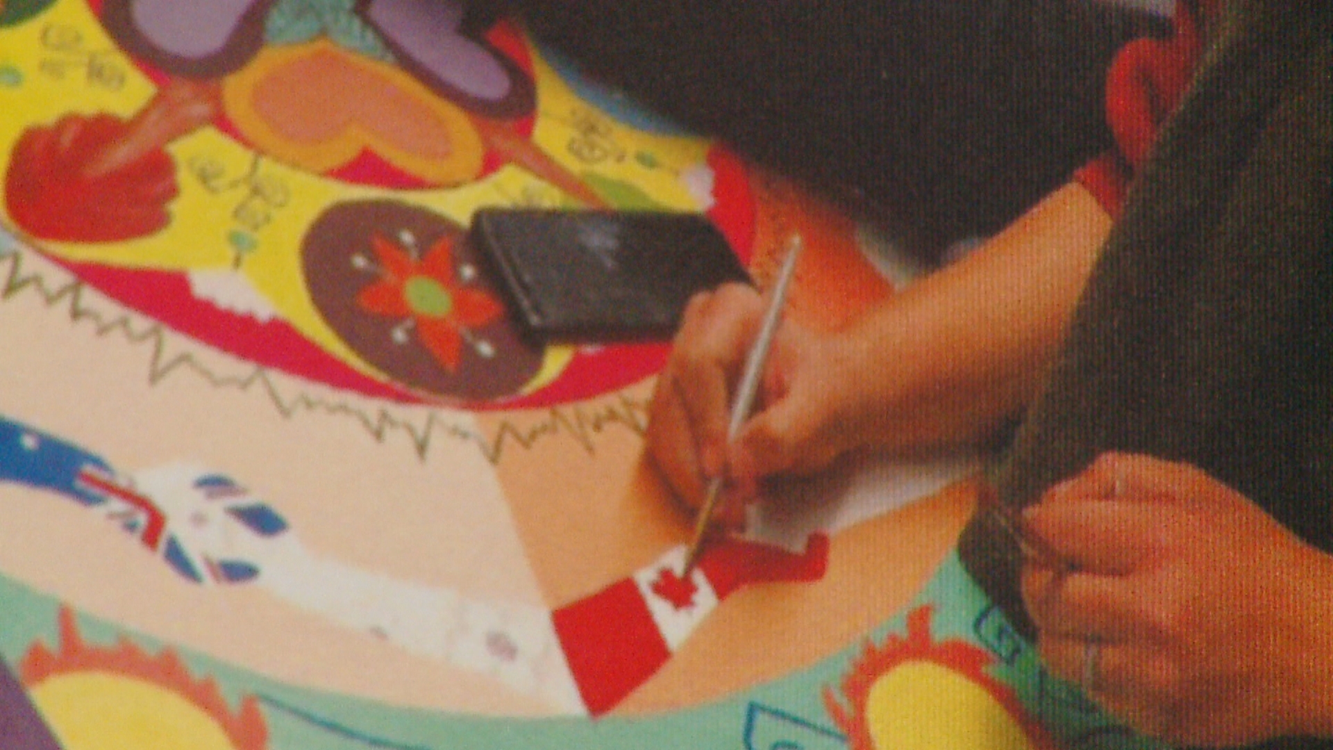 Afghan artists traveling mural makes stop at Indianapolis Artsgarden