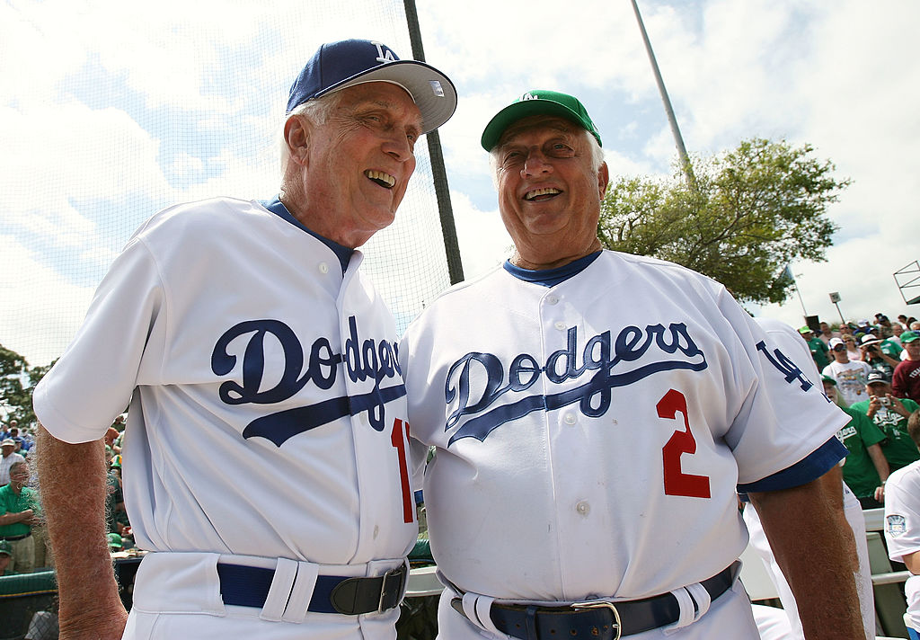 Carl Erskine #17 and manager Tommy Lasorda #2 of the Los Angeles Dodgers talk before the final game for the Dodgers in Dodgertown before taking on the Houston Astros in a Spring Training game at Holman Stadium on March 17, 2008 in Vero Beach, Florida. Erskine played at Dodgertown 50 years ago, played the National Anthem on his harmonica before the game. (Photo by Doug Benc/Getty Images)