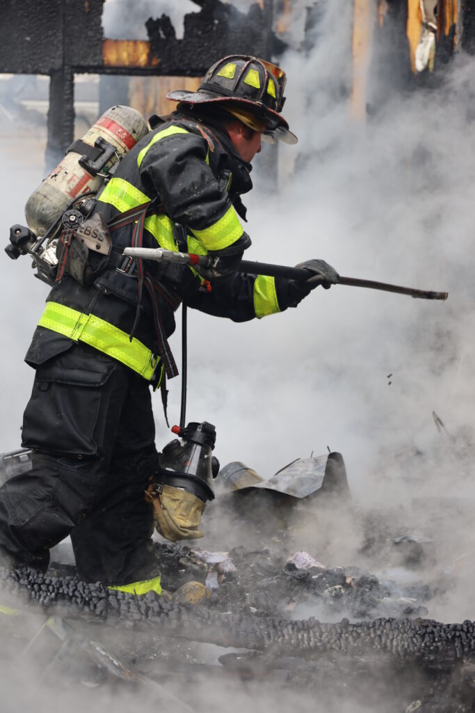 A member of the Indianapolis Fire Department at the scene of a house fire near Acton Elementary School in Marion County on April 24, 2023. (Provided Photo/Indianapolis Fire Department)