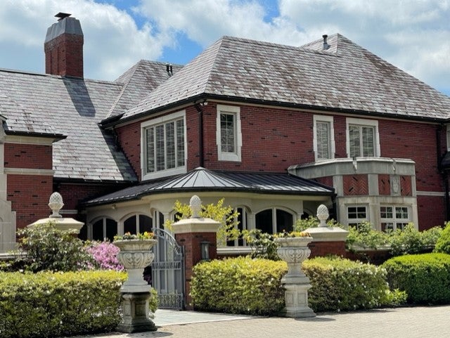 the gates to the mansion