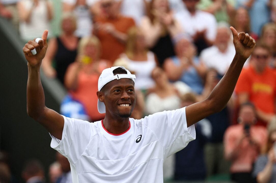 American tennis player Christopher Eubanks celebrates winning his fourth-round match at Wimbledon against Stefanos Tsitsipas. (Photo by Toby Melville/Reuters)