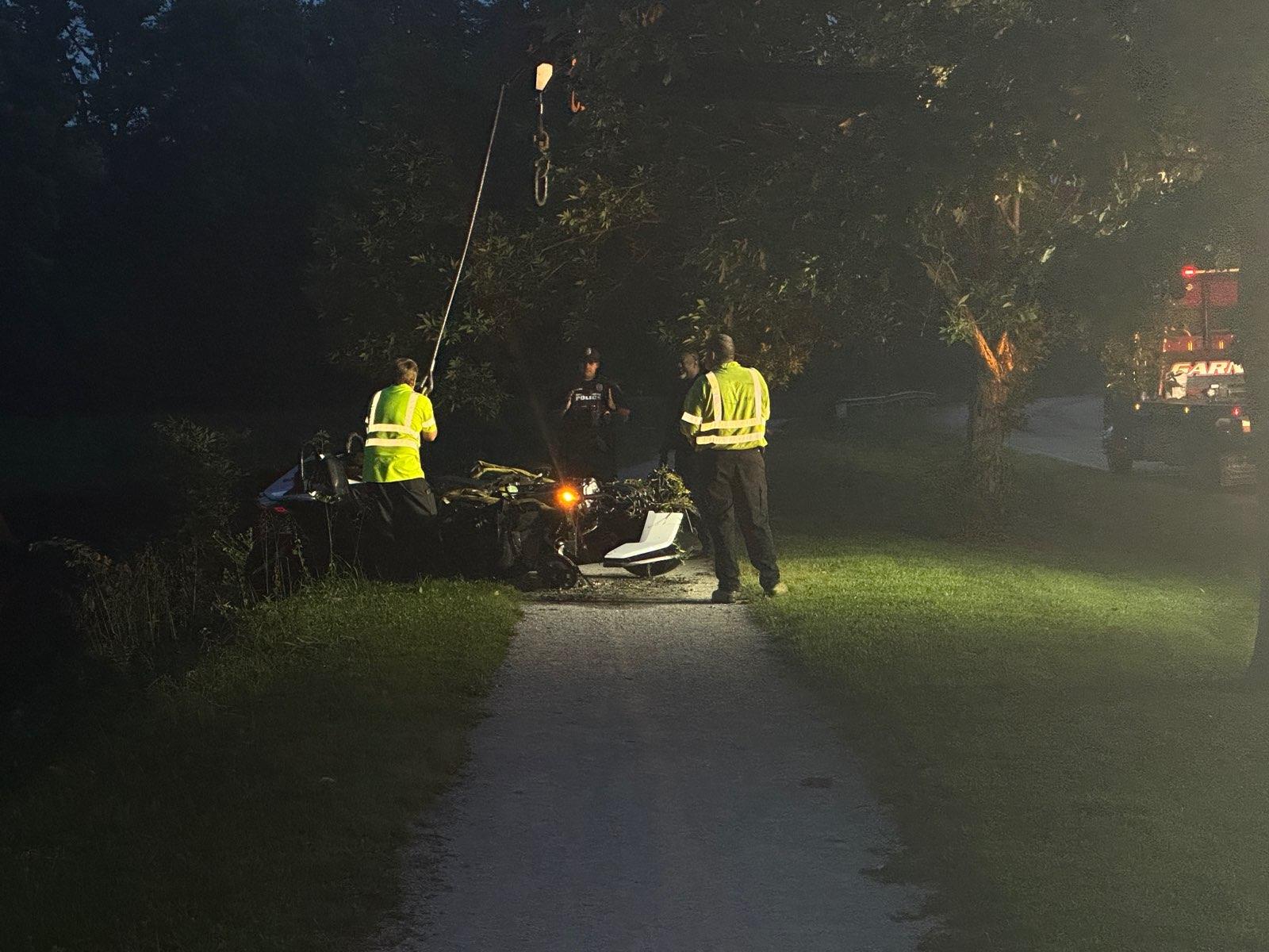 Firefighters pull vehicle from canal on Indy’s north side