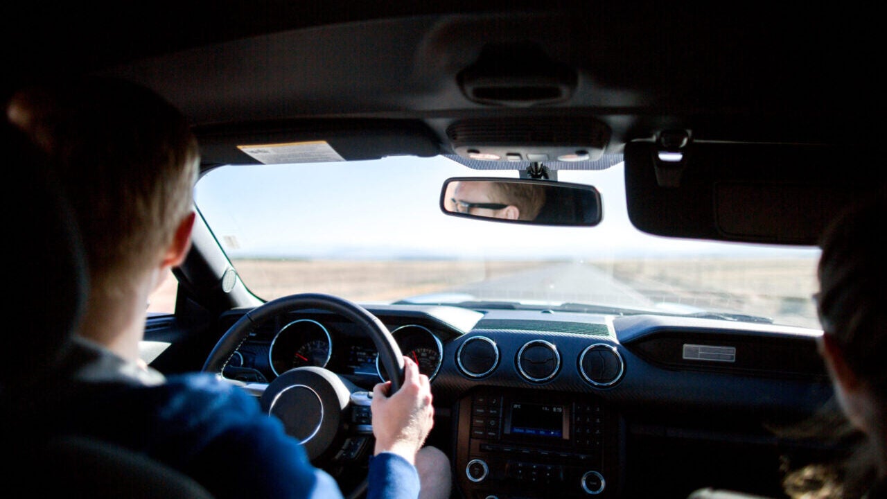 A tourist and passenger, driving down the road toward Yosemite National Park. (Photo by Morten Falch Sortland/Getty Images)