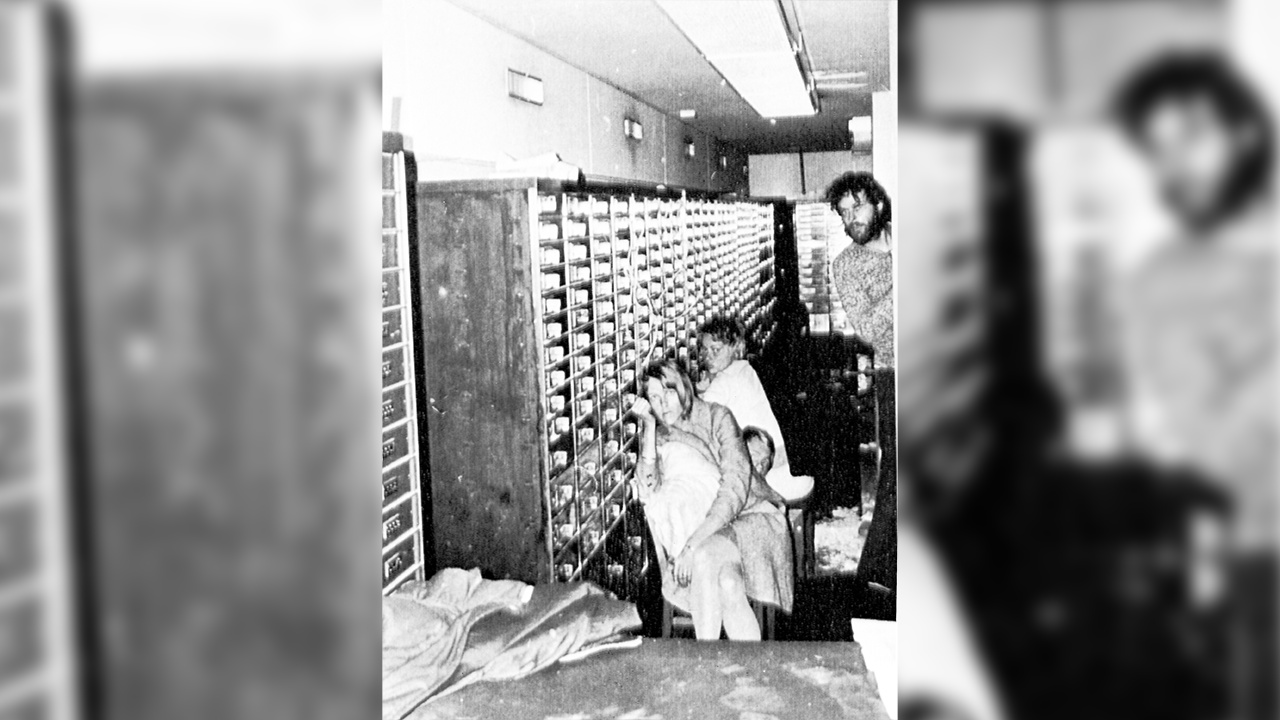 FILE - In this photo released by police, three of the four hostages and bank robber Clark Olofsson, standing right, are seen in a bank in Stockholm, Sweden, Aug. 27, 1973, shortly before the gunmen were overwhelmed by police. This week marks 50 years since a failed bank robbery that gave rise to the Stockholm syndrome, a term used in psychology to describe the bond that victims of kidnappings or hostage situations sometimes develop with their captors. (AP Photo, File)