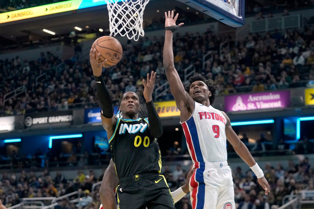 Indiana Pacers' Bennedict Mathurin (00) shoots against Detroit Pistons' Ausar Thompson (9) during the first half on an NBA In-Season Tournament basketball game, Friday, Nov. 24, 2023, in Indianapolis. (AP Photo/Darron Cummings)