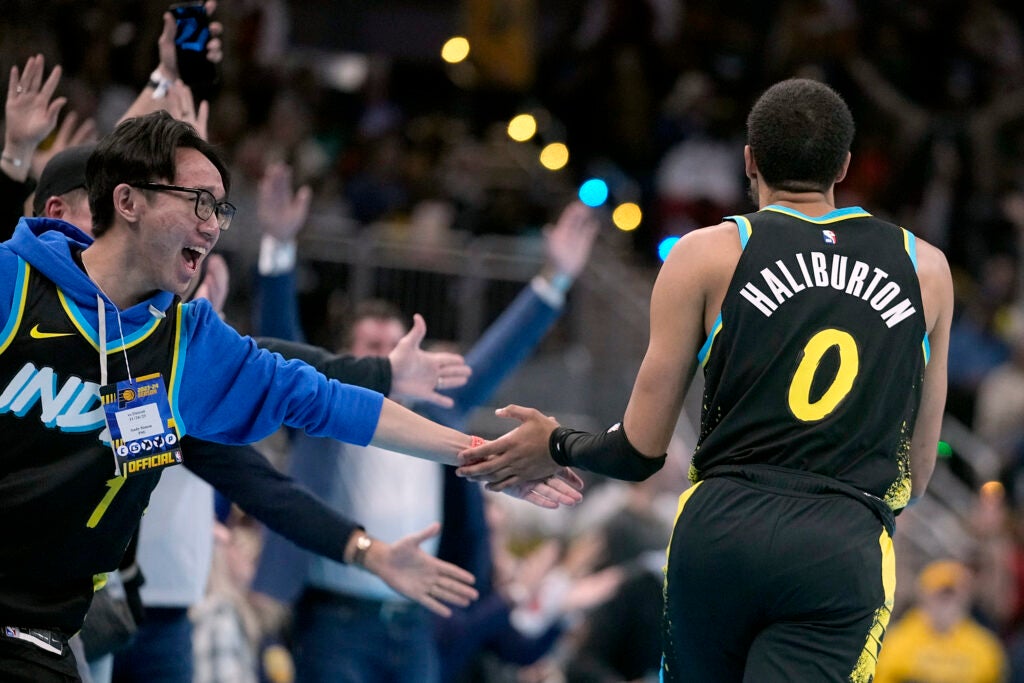 Indiana Pacers' Tyrese Haliburton celebrates with fans after hitting a three point shot during the first half on an NBA in-season tournament basketball game against the Detroit Pistons, Friday, Nov. 24, 2023, in Indianapolis