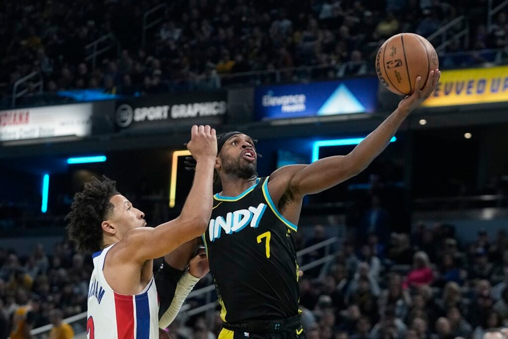 Indiana Pacers' Buddy Hield (7) shoots against Detroit Pistons' Cade Cunningham, left, during the first half of an NBA basketball In-Season Tournament game Friday, Nov. 24, 2023, in Indianapolis.