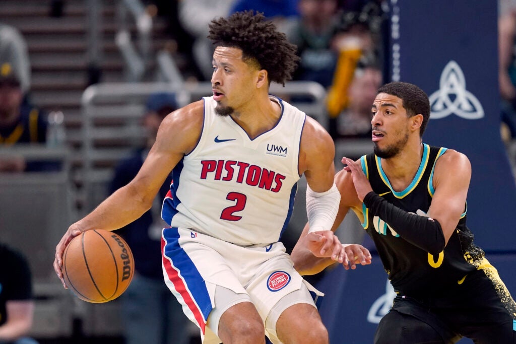 Detroit Pistons' Cade Cunningham (2) makes a move against Indiana Pacers' Tyrese Haliburton during the first half on an NBA in-season tournament basketball game, Friday, Nov. 24, 2023, in Indianapolis. (AP Photo/Darron Cummings)