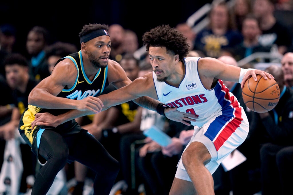 Detroit Pistons' Cade Cunningham, right, is defended by Indiana Pacers' Bruce Brown during the first half on an NBA in-season tournament basketball game, Friday, Nov. 24, 2023, in Indianapolis. (AP Photo/Darron Cummings)