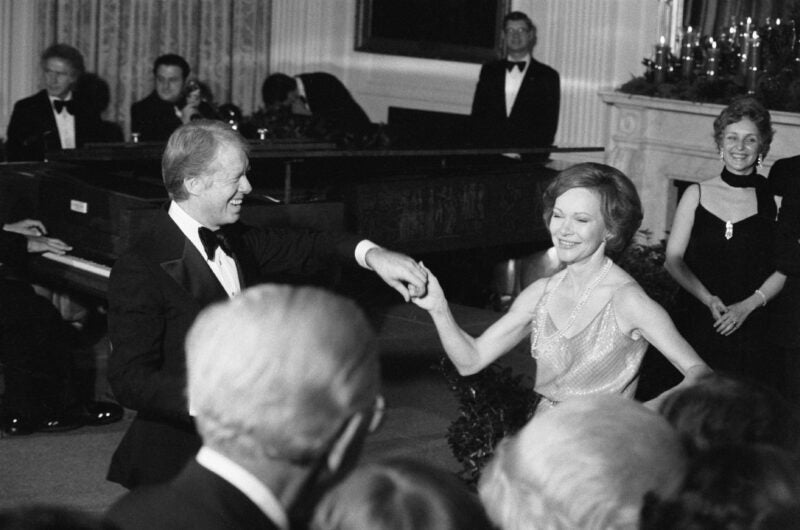 Washington, DC: President and Mrs. Carter take to the dance floor at the White House as they host a Christmas Ball for members of congress and their wives. Already the longest-lived of the 45 men to serve as U.S. president, Jimmy Carter has reached the century mark. Carter, who remains under home hospice care, and will celebrate his 100th birthday on Tuesday. (Photo by © CORBIS/Corbis via Getty Images)