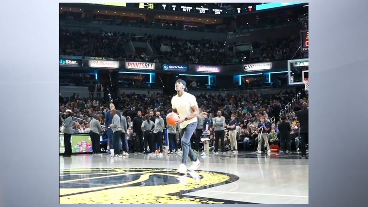 A screenshot of a video where Pacers fan Matthew Crittendon made a half-court, winning a $25,000 prize.