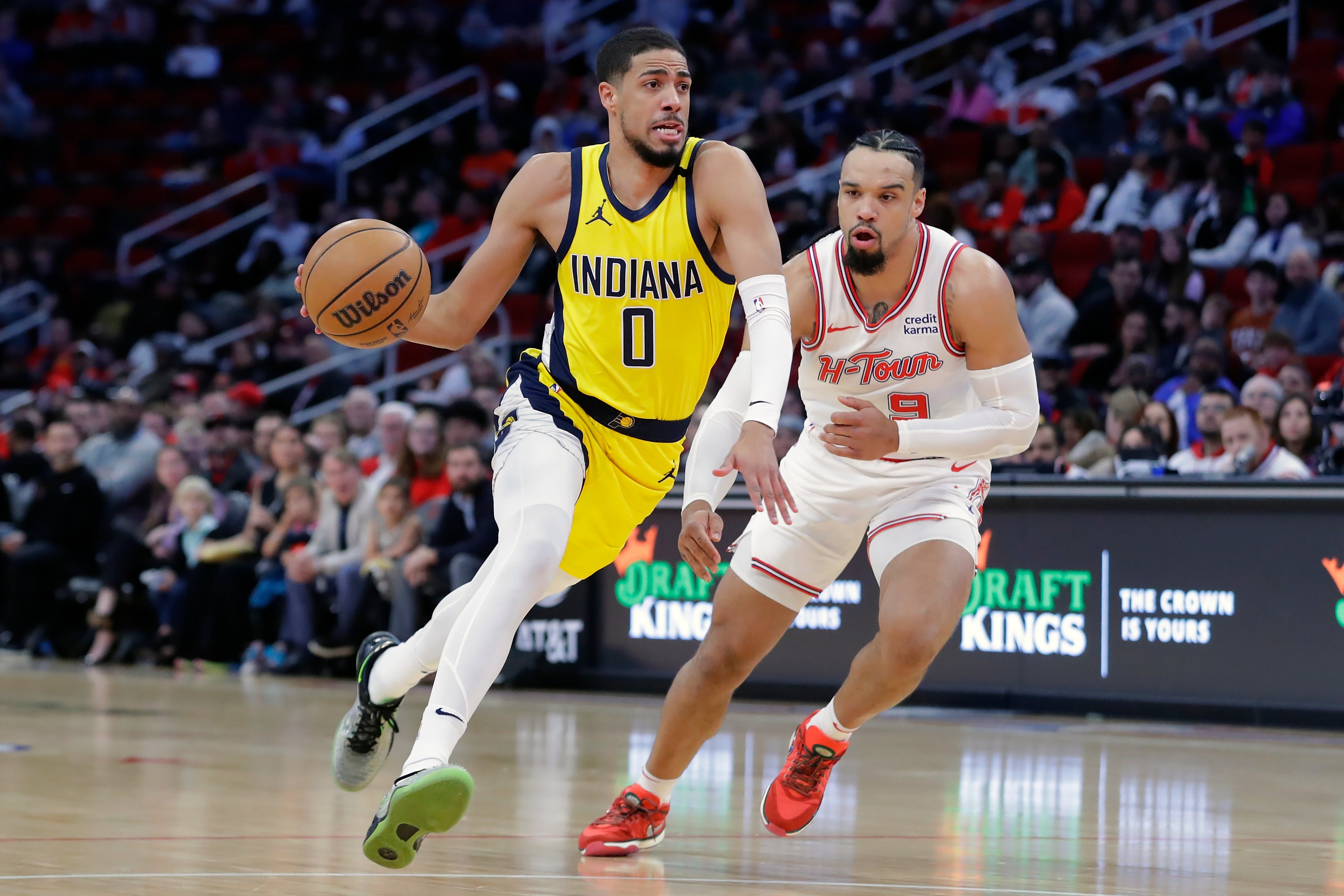 Indiana Pacers guard Tyrese Haliburton (0) drives in front of Houston Rockets forward Dillon Brooks during the first half of an NBA basketball game Tuesday, Dec. 26, 2023, in Houston. (AP Photo/Michael Wyke)