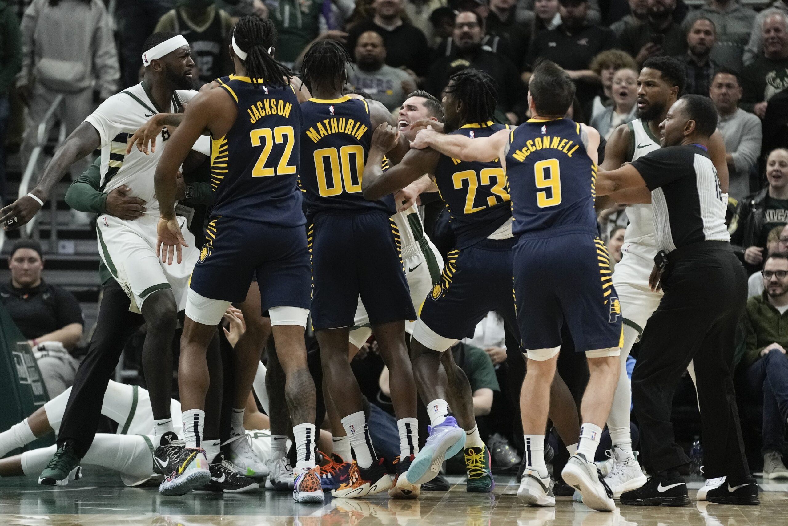 Milwaukee Bucks and Indiana Pacers players scuffle during the second half of an NBA basketball game Wednesday, Dec. 13, 2023, in Milwaukee. (AP Photo/Morry Gash)