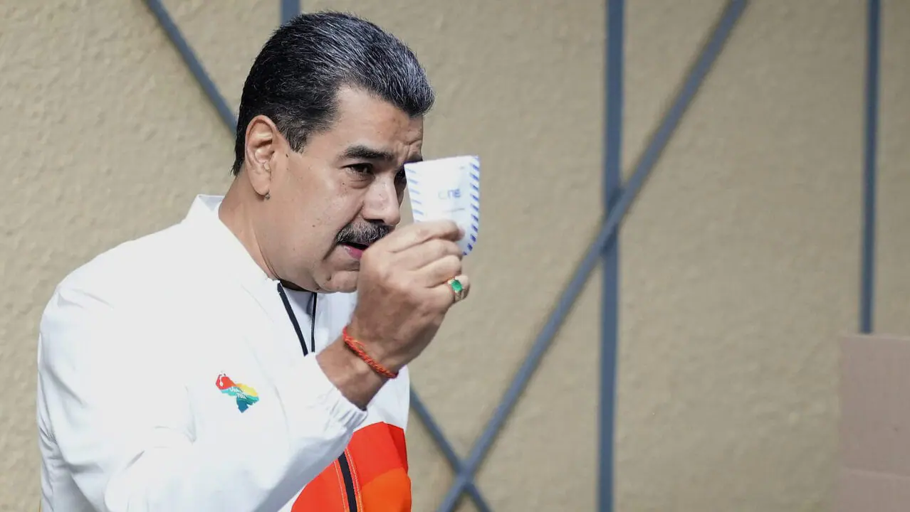 President Nicolas Maduro votes in a referendum regarding Venezuela's claim to the Essequibo, a region administered and controlled by Guyana in Caracas, Venezuela, on Dec. 3, 2023. (AP Photo/Matias Delacroix)