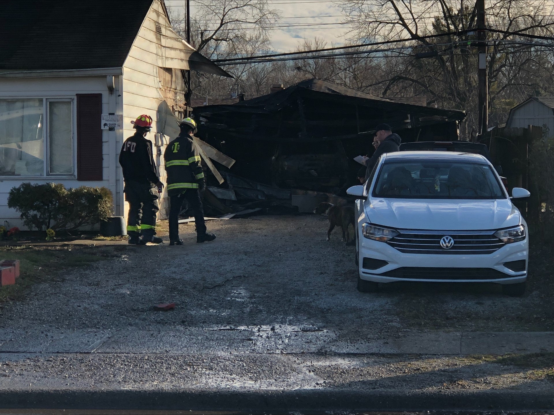 Four people were injured and two dogs died in a house and garage fire on the northwest side of Indianapolis on Dec. 20, 2023.