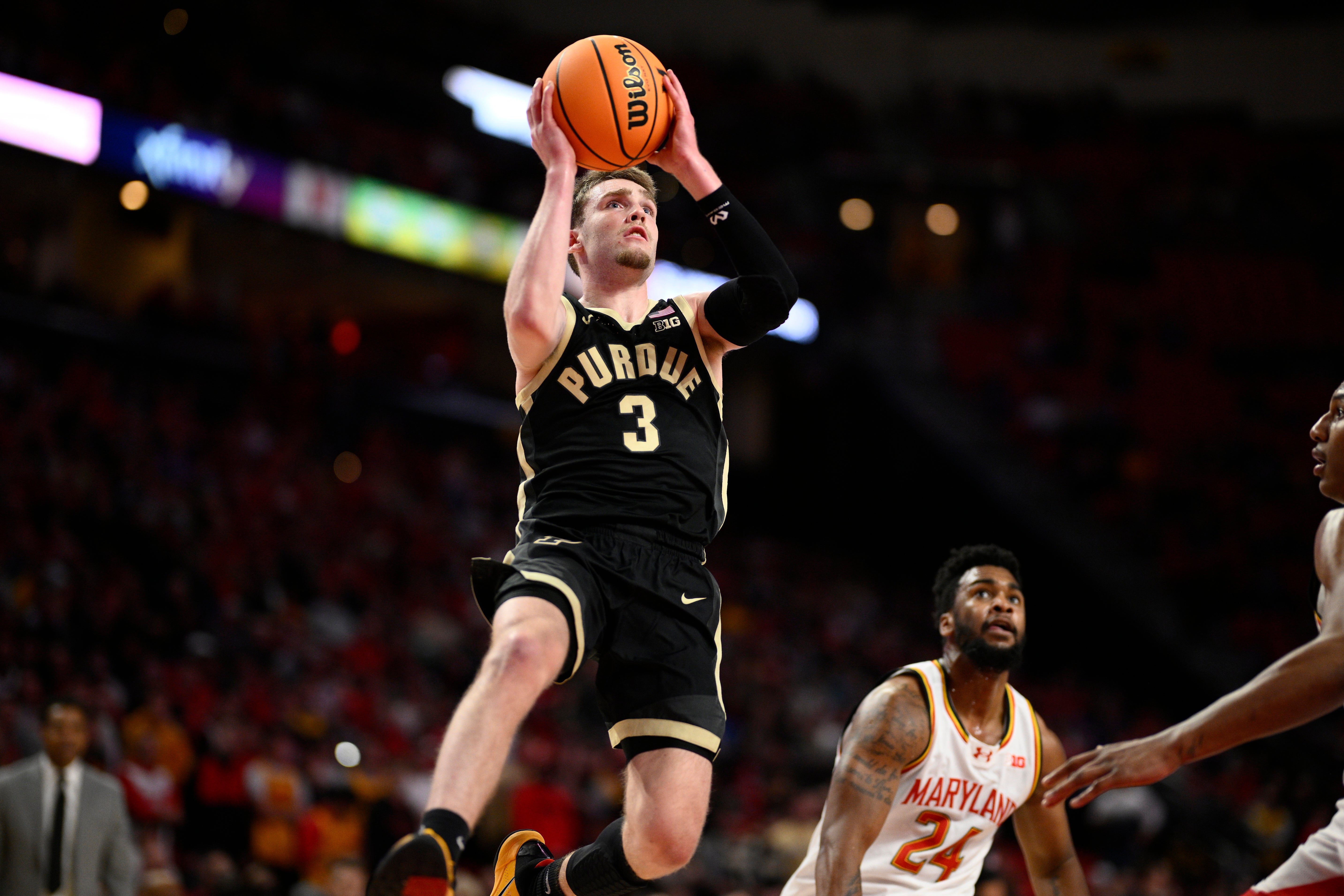 Purdue guard Braden Smith (3) goes to the basket past Maryland forward Donta Scott (24) during the first half of an NCAA college basketball game Jan. 2, 2024, in College Park, Md.