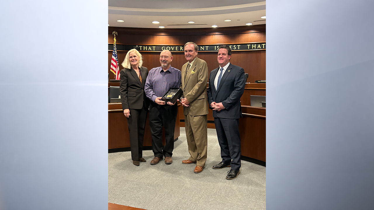 County Surveyor Kenton Ward (second from left) was honored at Monday’s meeting of the Hamilton County Commissioners. Also pictured from left are Commissioners Christine Altman, Steve Dillinger, and President Mark Heirbrandt. (Provided Photo/The Reporter)