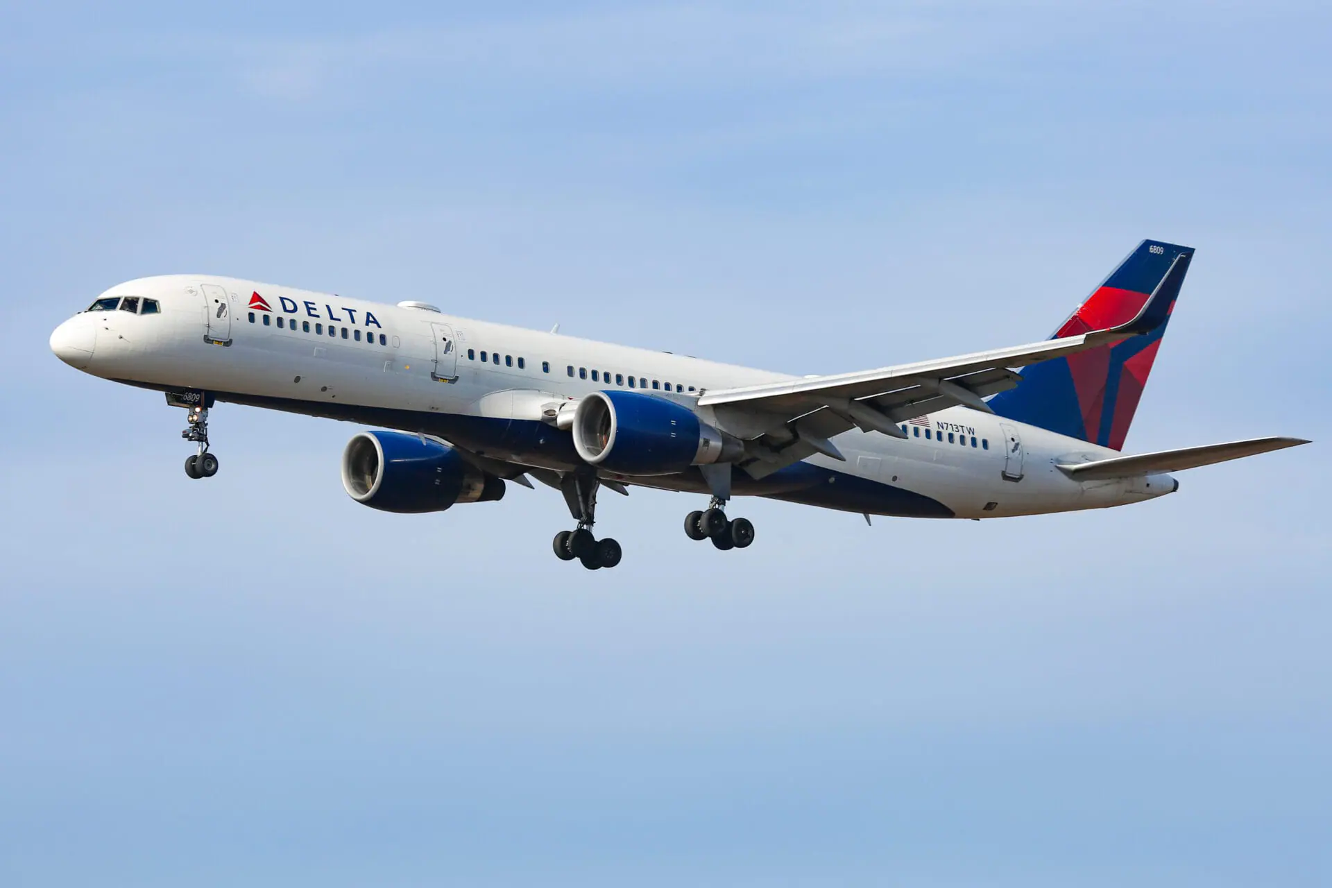 Delta Air Lines Bombardier Boeing 757-200 aircraft as seen arriving, on final approach for landing in New York JFK John F. Kennedy International Airport. The B757 narrow body airplane was flying previously for TWA Trans World Airlines and AA American Airlines. The registration the Boing 757 plane is N713TW and is powered by 2x PW jet engines. Delta Airlines is the second-largest in the world, member of SkyTeam aviation alliance with headquarters in Atlanta, Georgia. NY, USA on 2nd February 2020