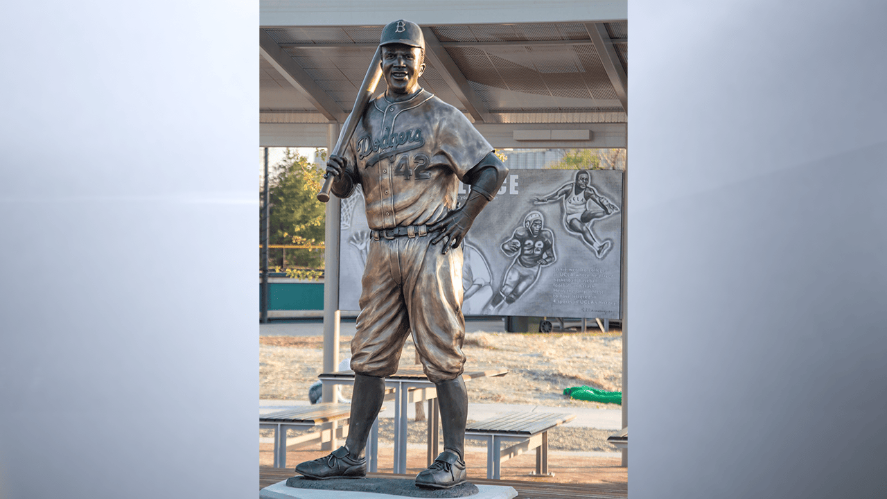 In this photo provided by Mel Gregory, the statue of baseball legend Jackie Robinson is seen April 18, 2021, in Wichita. The statue was later found burned and in pieces in a trash can. (Photo by Mel Gregory via AP)