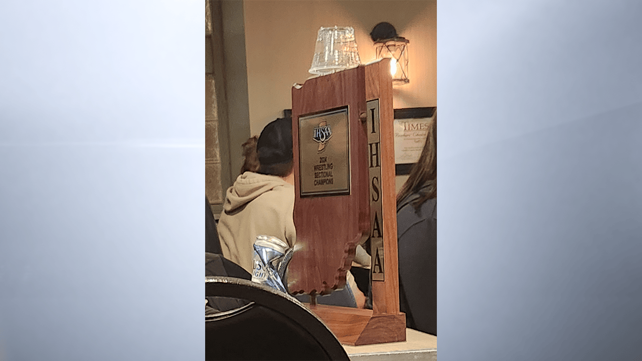 By 7:30 p.m. Saturday night, Noblesville’s sectional trophy was on public display as a repository of empty alcohol containers. The wrestling sectional trophy young athletes at Noblesville High School had worked so hard to earn was decorated with trash at a bar. (Provided photos via The REPORTER)