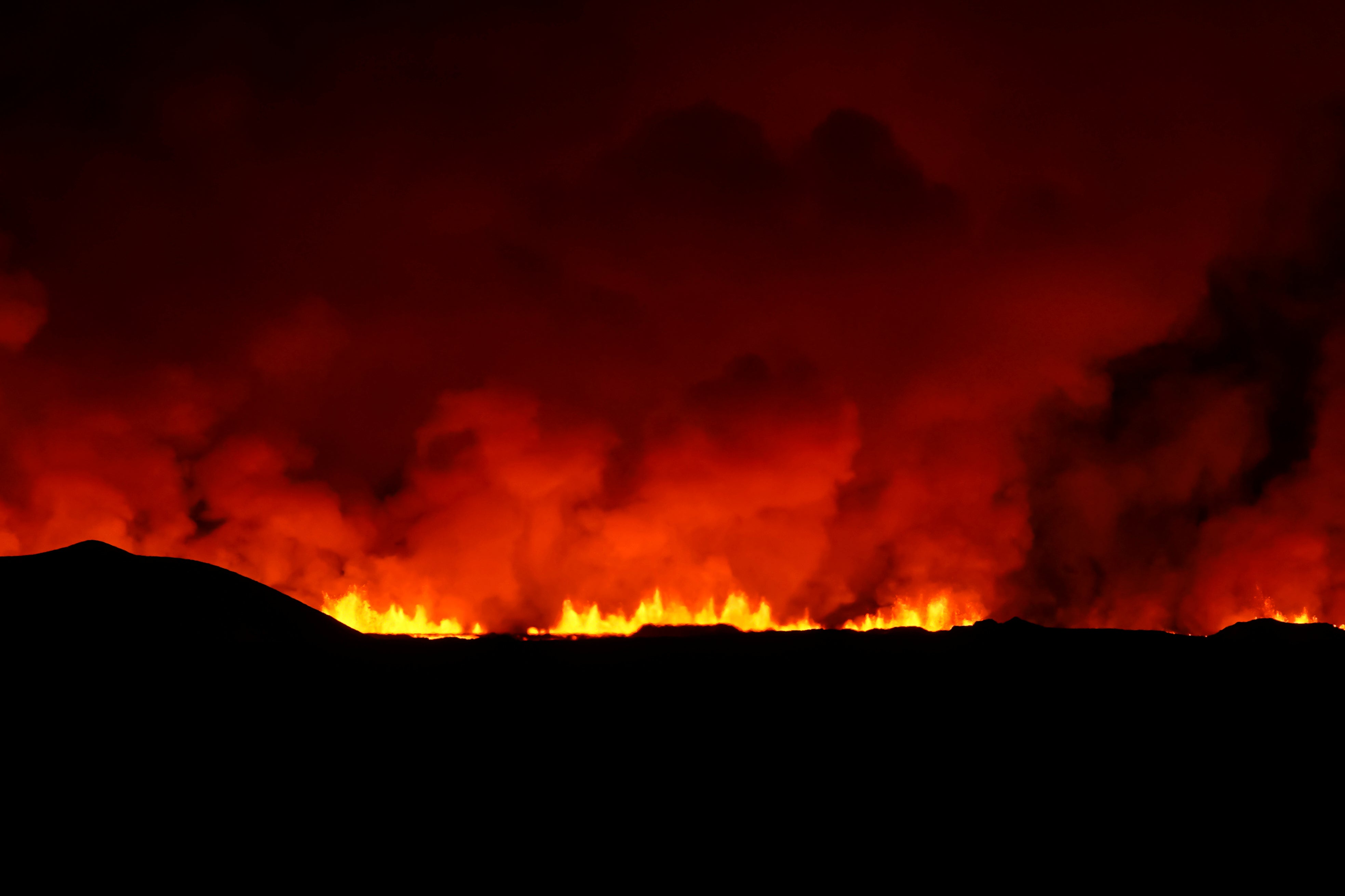 A view of the volcano erupting, north of Grindavík, Iceland, Thursday, Feb. 8, 2024. Iceland’s Meteorological Office says a volcano is erupting in the southwestern part of the country, north of a nearby settlement. The eruption of the Sylingarfell volcano began at 6 a.m. local time on Thursday, soon after an intense burst of seismic activity. (AP Photo/Marco Di Marco)