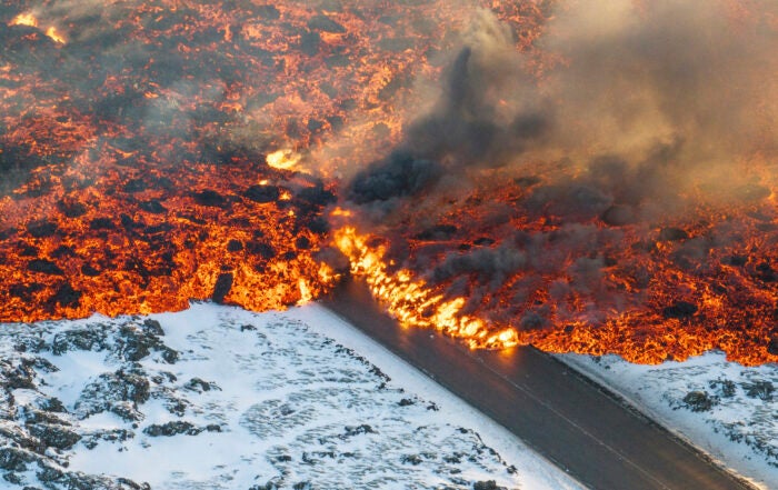 Lava devours roads after volcano erupts in Iceland