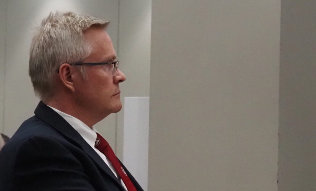 John Rust appears before the Indiana Election Commission on Tuesday, Feb. 27, 2024, in Indianapolis. The commission ultimately voted to remove Rust from the 2024 Republican primary ballot. (Photo by Casey Smith/Indiana Capital Chronicle)