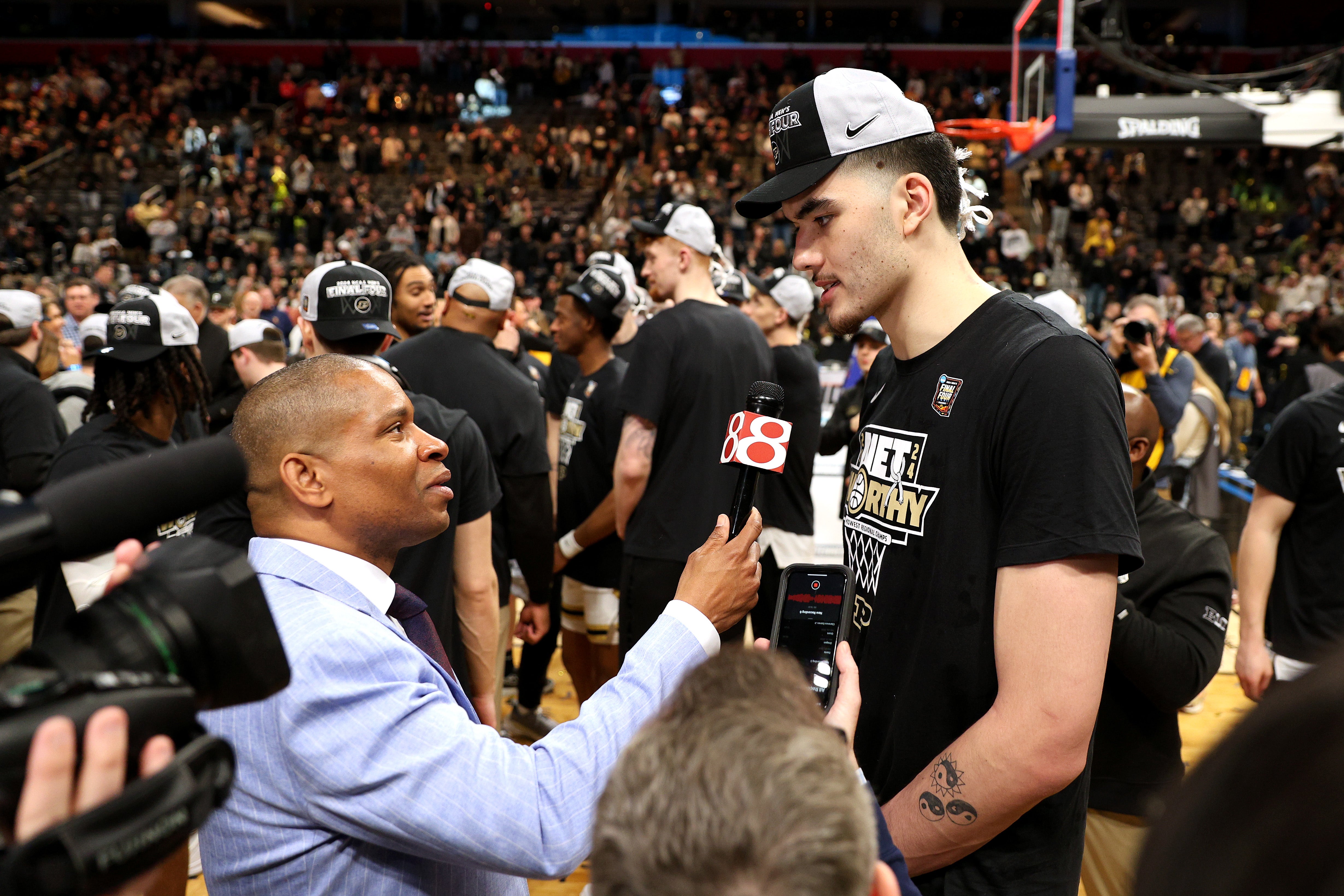 Zach Edey #15 of the Purdue Boilermakers talks to News 8 sports director Anthony Calhoun after defeating the Tennessee Volunteers in the Elite 8 round of the NCAA Men's Basketball Tournament at Little Caesars Arena on March 31, 2024 in Detroit, Michigan. (Photo by Mike Mulholland/Getty Images)