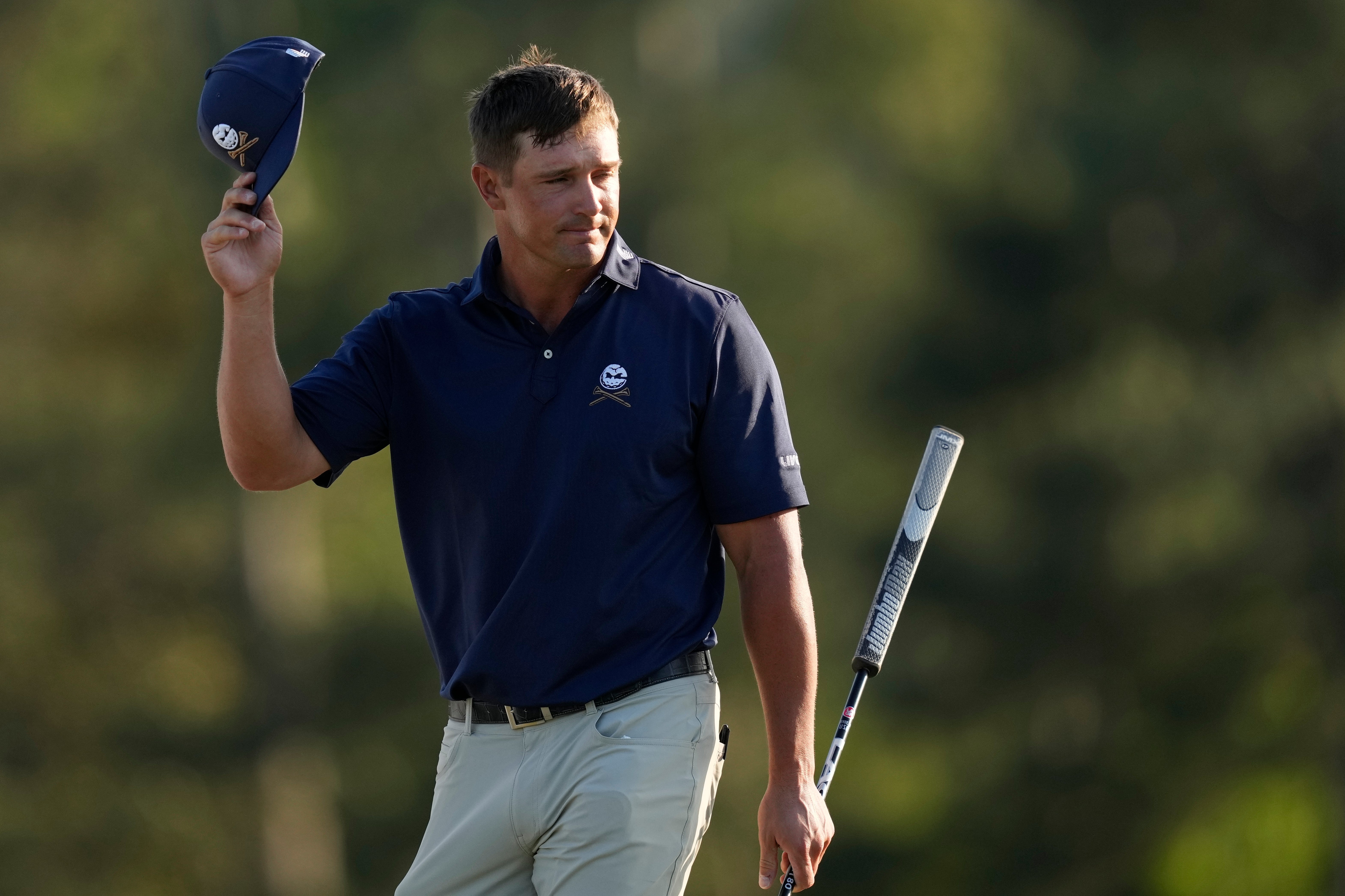 Bryson DeChambeau waves after finishing his final round at the Masters golf tournament at Augusta National Golf Club Sunday, April 14, 2024, in Augusta, Ga. (AP Photo/David J. Phillip)