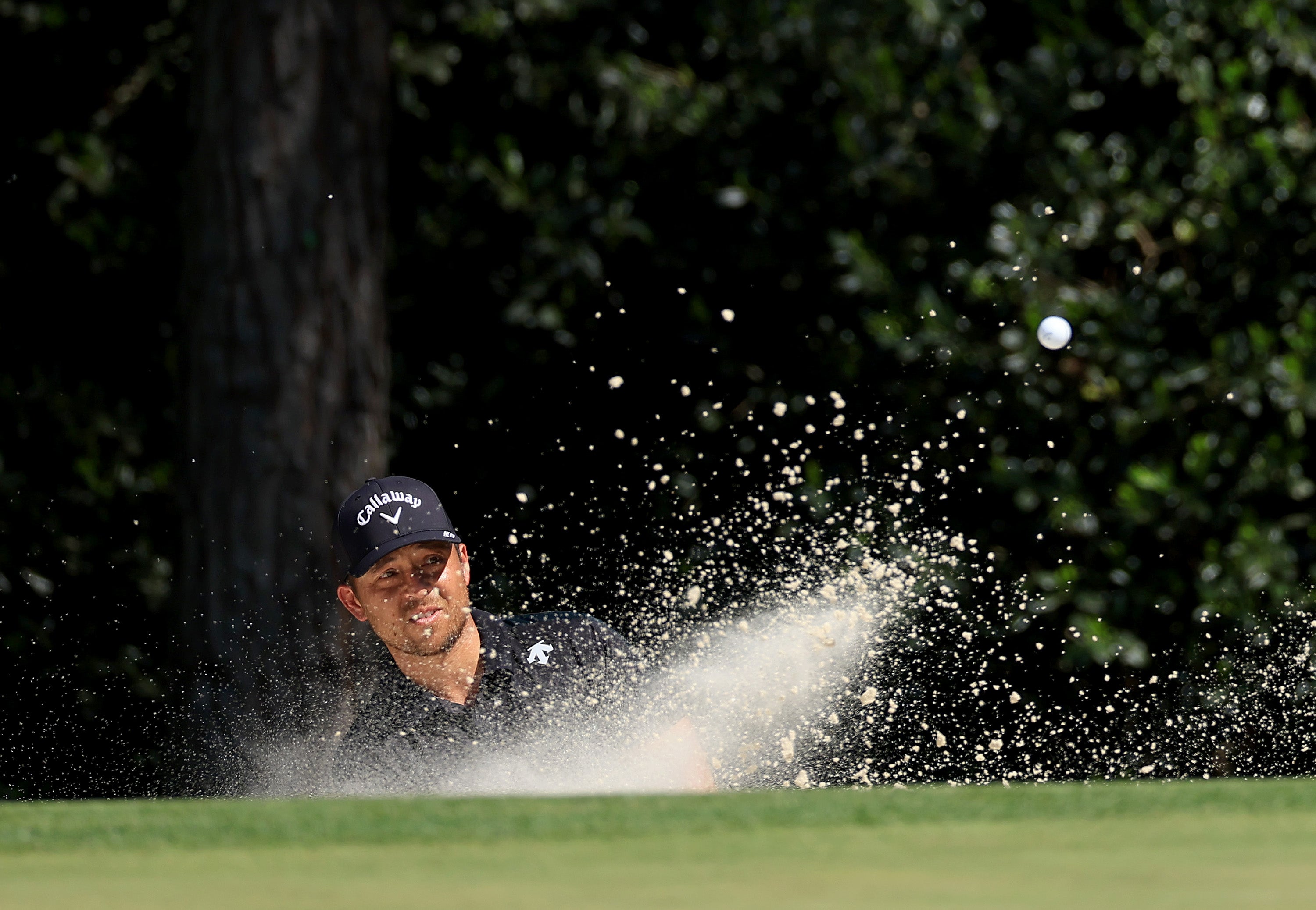 Xander Schaffele of The United States plays his third shot on the fifth hole during the final round of the 2024 Masters Tournament at Augusta National Golf Club on April 14, 2024 in Augusta, Georgia. (Photo by David Cannon/Getty Images)