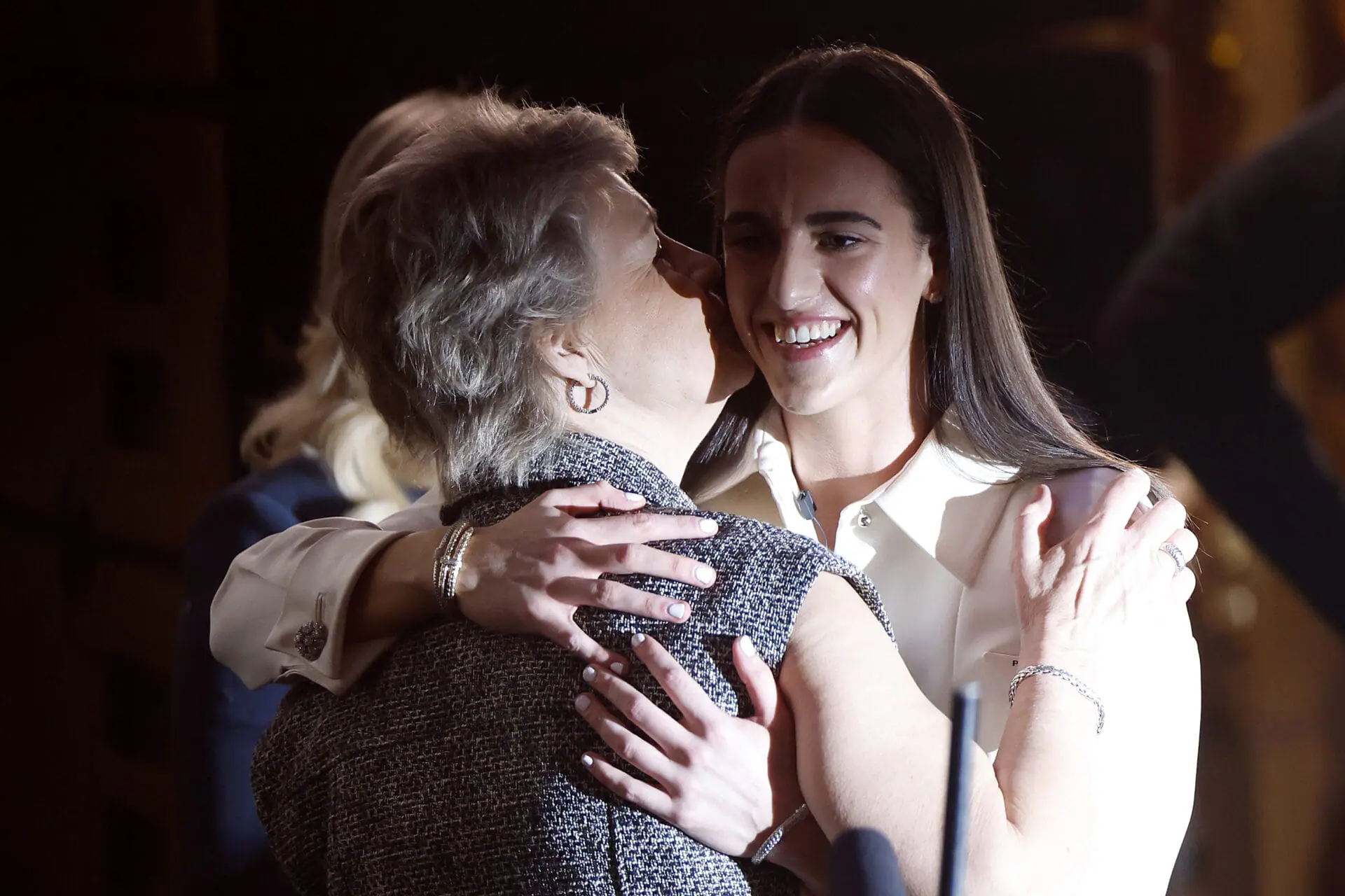 Head coach Lisa Bluder of the Iowa Hawkeyes kisses Caitlin Clark after being selected first overall pick by the Indiana Fever during the 2024 WNBA Draft at Brooklyn Academy of Music on April 15, 2024 in New York City. (Photo by Sarah Stier/Getty Images)