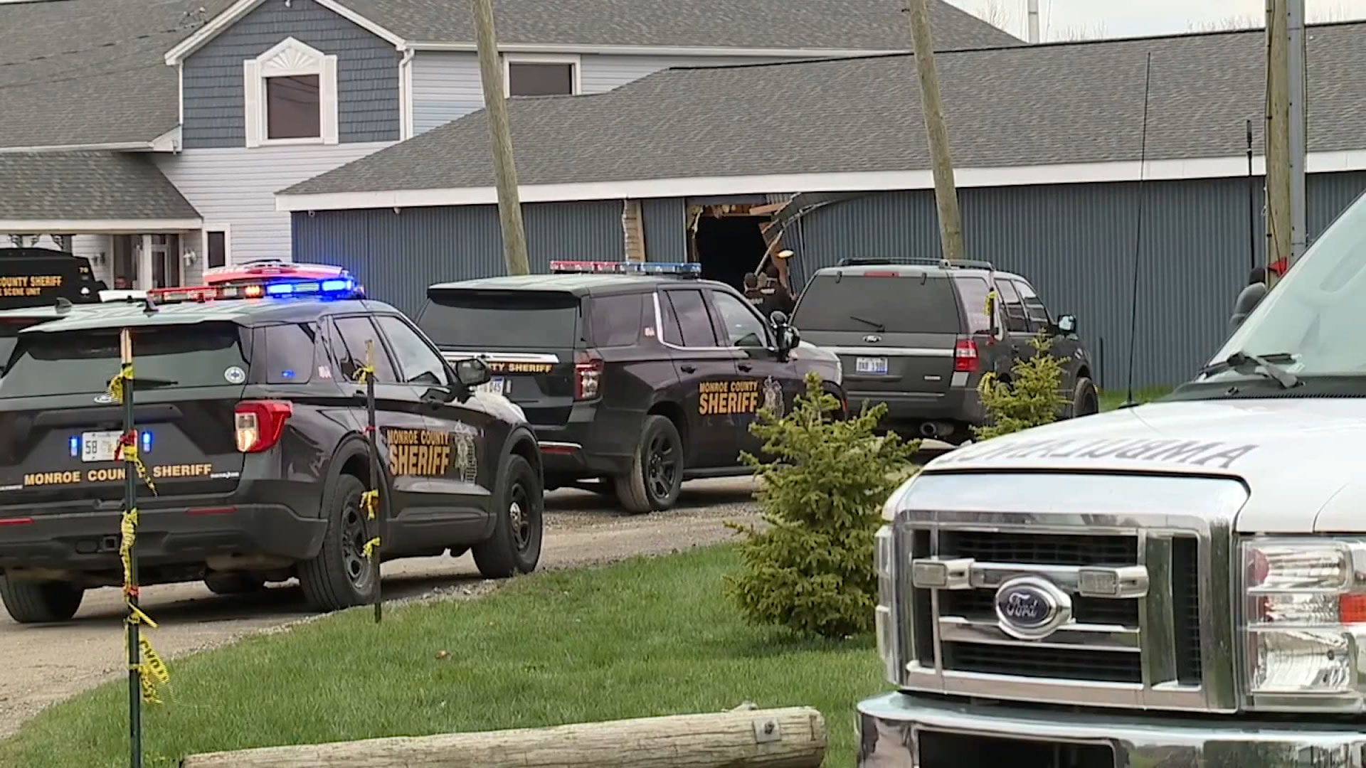 Police respond to the scene after a vehicle drove through a building in Newport, Michigan, on Saturday, April 20. Police say the incident killed two young siblings and injured at least 9 other people. (Photo by WXYZ via CNN Newsource)