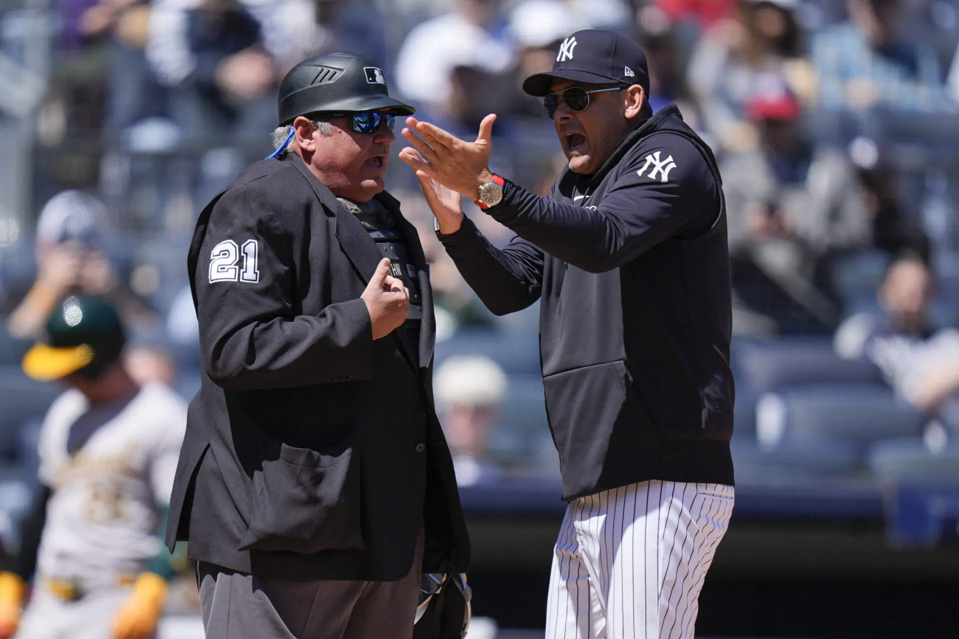 New York Yankees manager Aaron Boone, right, argues with umpire Hunter Wendelstedt during the first inning of the baseball game against the Oakland Athletics at Yankee Stadium Monday, April 22, 2024, in New York. Boone was ejected from the game.