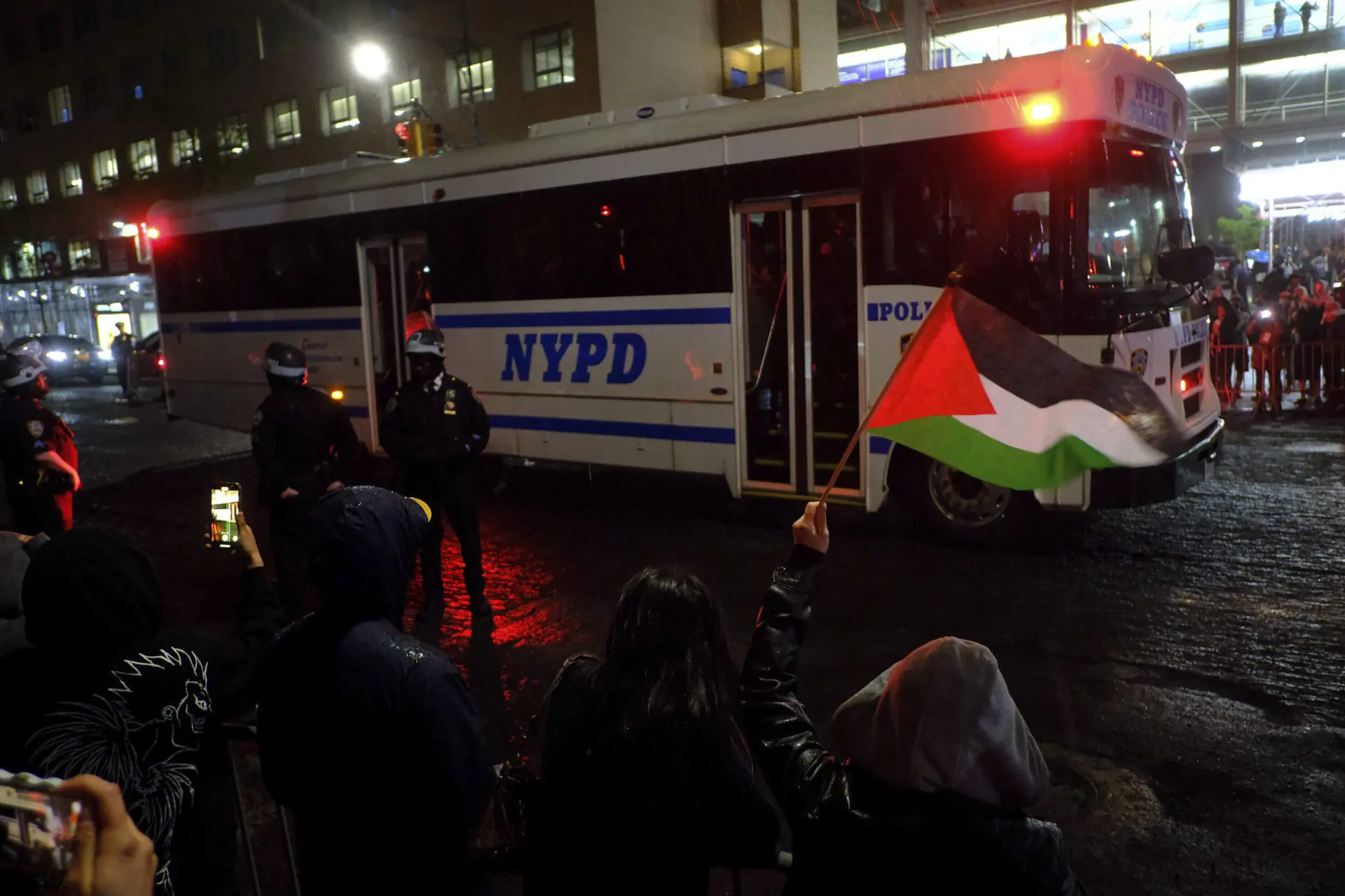 A New York Police bus filled with arrested protesters makes its way down Amsterdam Avenue, Tuesday, April 30, 2024, in New York.