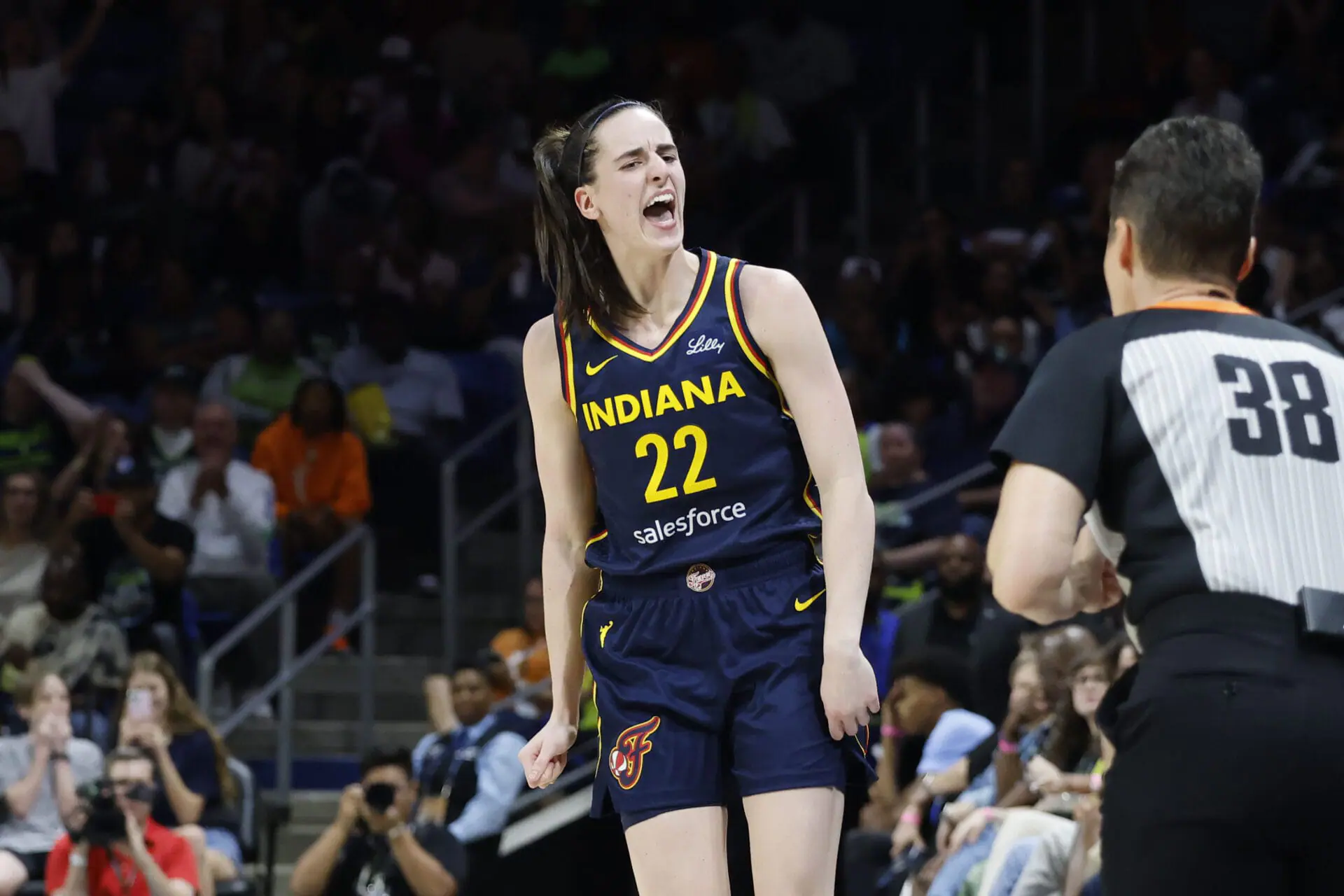 Indiana Fever guard Caitlin Clark (22) reacts after making a three-point shot against the Dallas Wings during the first half of an WNBA basketball game in Arlington, Texas, Friday, May 3, 2024.