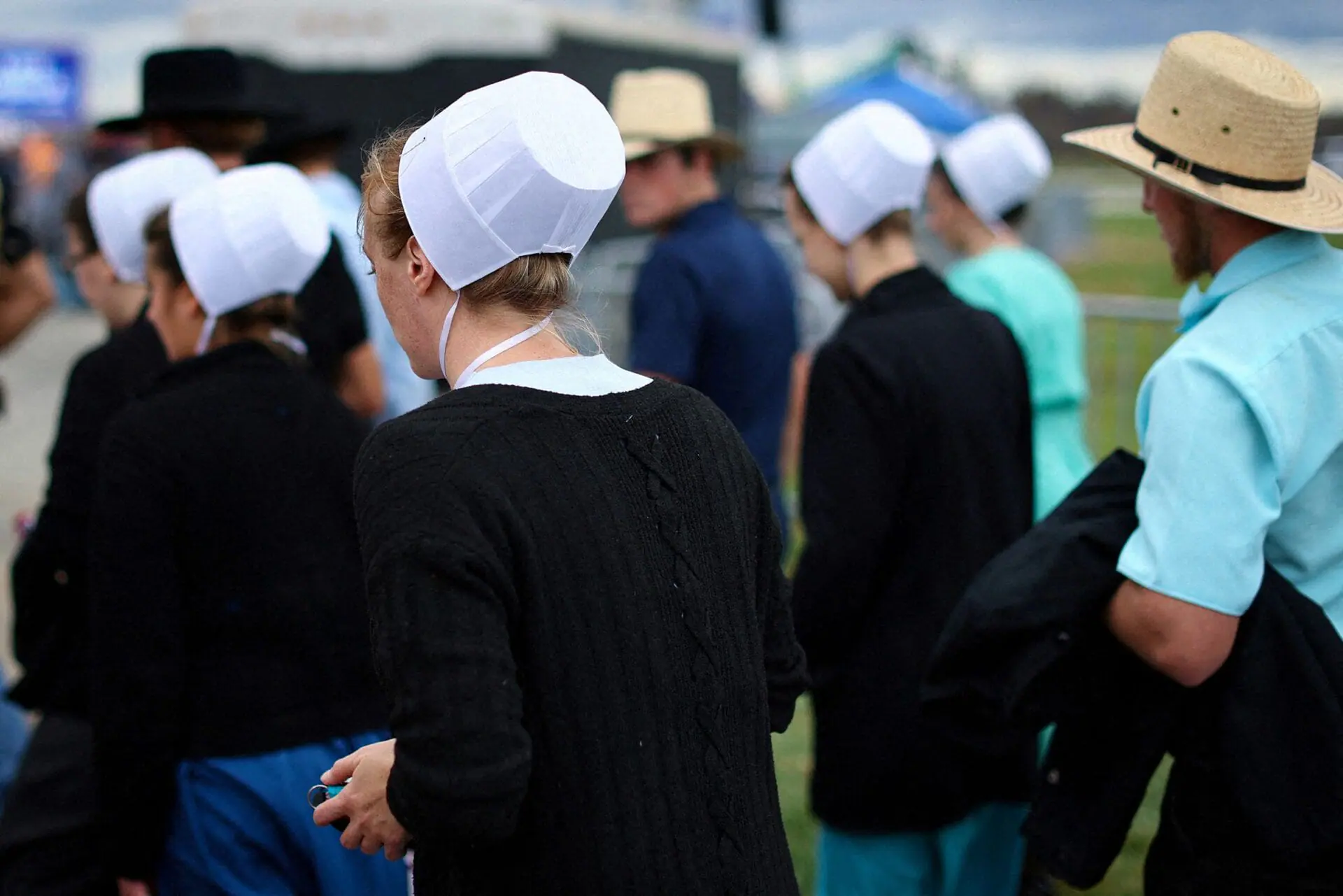 A group of Amish people in Latrobe, Pennsylvania in 2022. A rite of passage for young people in some Amish communities, Rumspringa is seen by most outsiders as a wild time away from strict Amish rules, when teenagers can experiment with the modern vices of the world. While that may be true for some Amish communities, Rumspringa is actually a much more general — and generally more tame — term for an important time of discernment in an Amish youth’s life. (Photo by Mike Segar/Reuters via CNN Newsource)