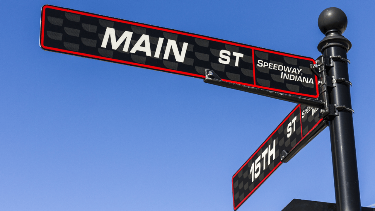 Main Street Speedway sign up close on 15th street looking up to a clear blue sign