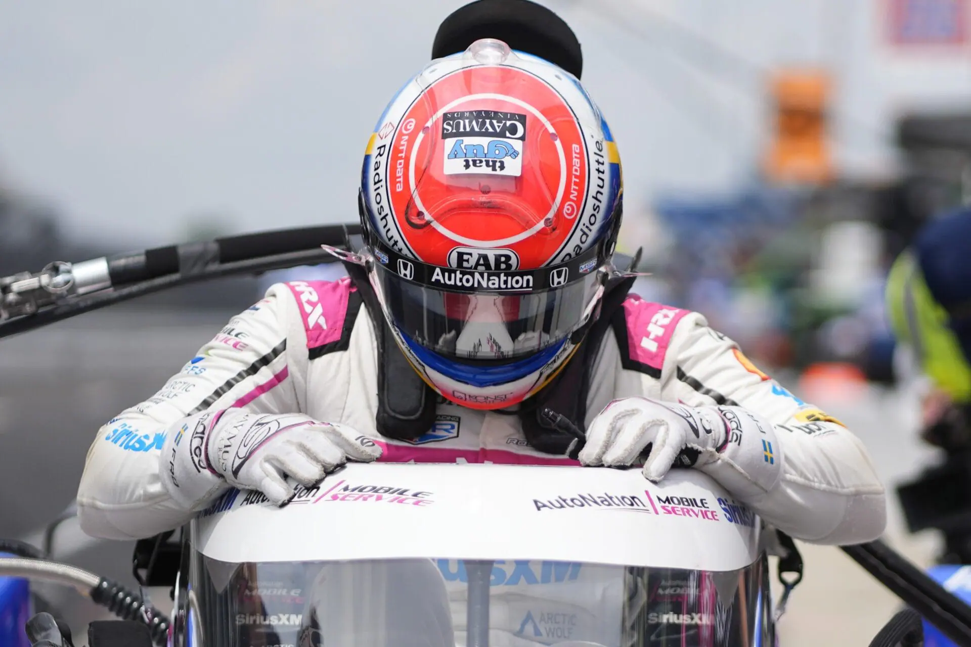 Felix Rosenqvist, of Sweden, climbs into his car during a practice session for the Indianapolis 500 auto race at Indianapolis Motor Speedway, Thursday, May 16, 2024, in Indianapolis. (AP Photo/Darron Cummings)