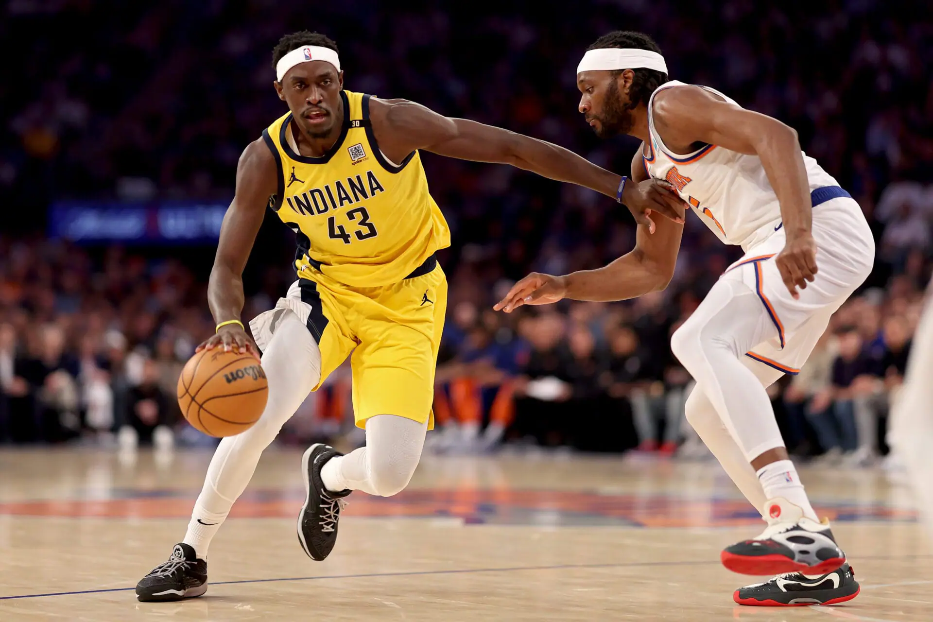 Pascal Siakam #43 of the Indiana Pacers dribbles the ball while being guarded by Precious Achiuwa #5 of the New York Knicks in the first quarter in Game Seven of the Eastern Conference Second Round Playoffs at Madison Square Garden on May 19, 2024 in New York City. (Photo by Elsa/Getty Images)