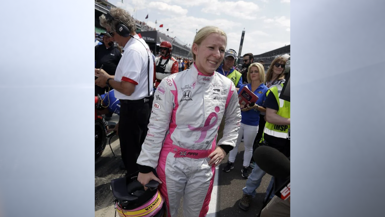 Racecar driver Pippa Mann stands on pit road at Indianapolis Motor Speedway before the 2019 Indianapolis 500. (WISH Photo)