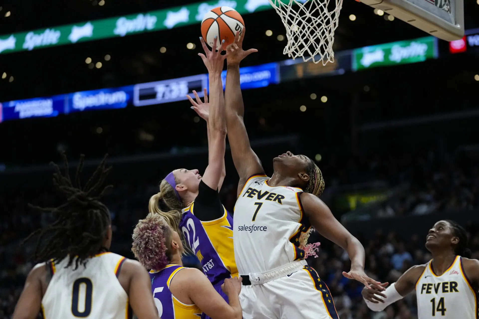 Los Angeles Sparks forward Cameron Brink (22) defends against Indiana Fever forward Aliyah Boston (7) during the first half of a WNBA basketball game in Los Angeles, Friday, May 24, 2024.