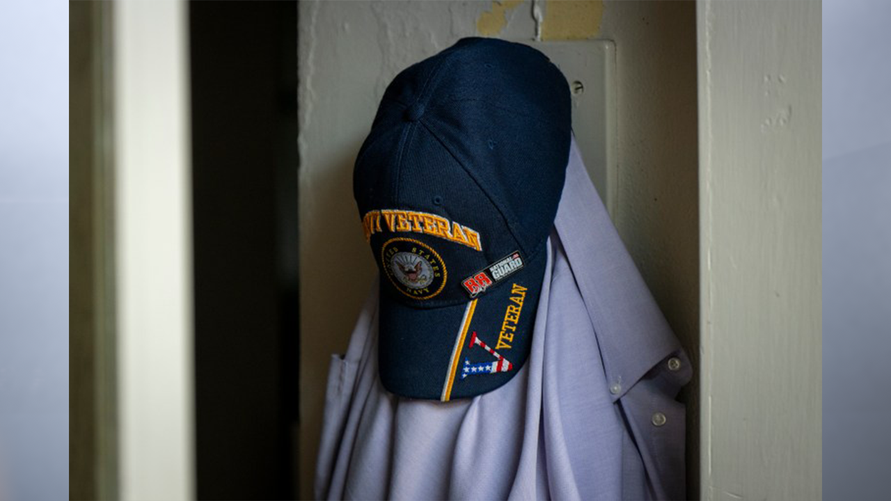 A Mirror Indy file image shows a Navy veteran’s hat hanging at a barber shop. Mirror Indy is also celebrating veterans who are still with us and may need help with physical or mental conditions connected to their service. (Photo by Doug McSchooler for Mirror Indy)