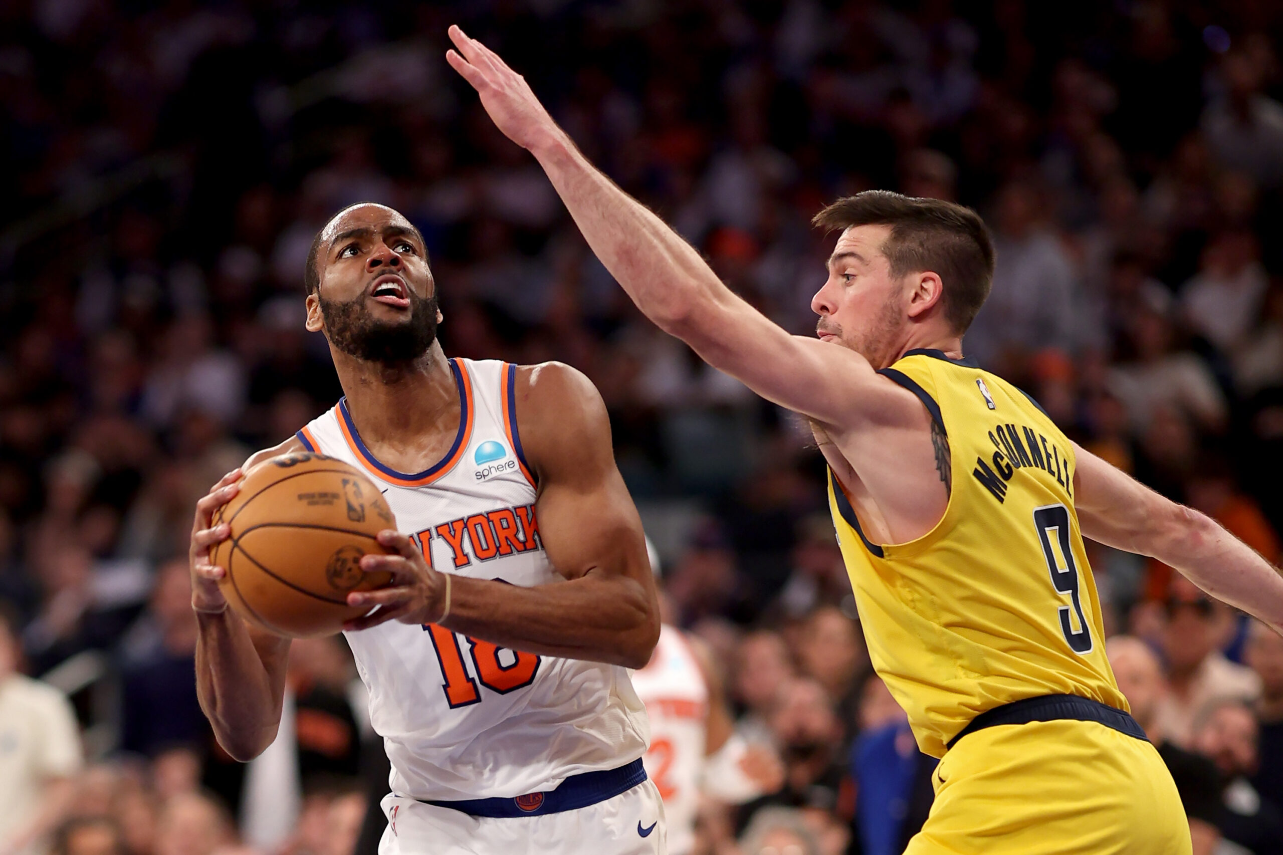 : Alec Burks #18 of the New York Knicks attempts a shot while being guarded by T.J. McConnell #9 of the Indiana Pacers in the third quarter in Game Seven of the Eastern Conference Second Round Playoffs at Madison Square Garden on May 19, 2024 in New York City. (Photo by Elsa/Getty Images)