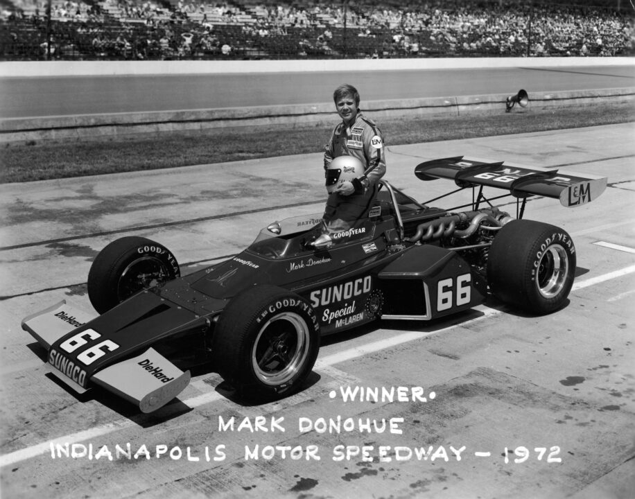 Portrait of American racing driver Mark Donohue (1937 - 1975) as he poses with his car after winning the Indianapolis 500 (Indy 500) race, Speedway, Indiana, May 1972. (Photo by Authenticated News/Getty Images)