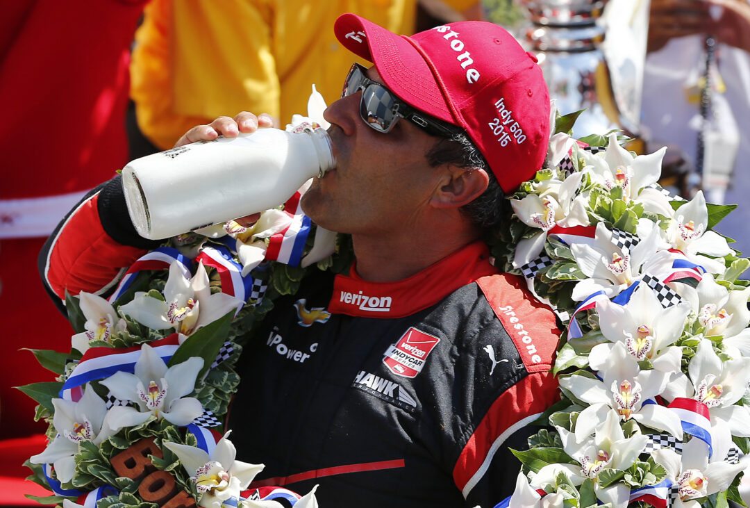 Juan Pablo Montoya of Colombia driver of the #2 Team Penske Chevrolet Dallara celebrates after winning the 99th running of the Indianapolis 500 mile race by drinking milk at the Indianapolis Motor Speedway on May 24, 2015 in Indianapolis, Indiana. (Photo by Jonathan Ferrey/Getty Images)